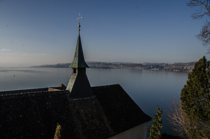 church spire over lake