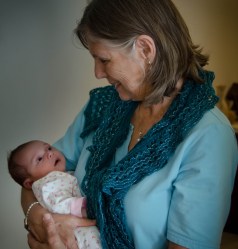 Grammi holding Elysse at 6 weeks