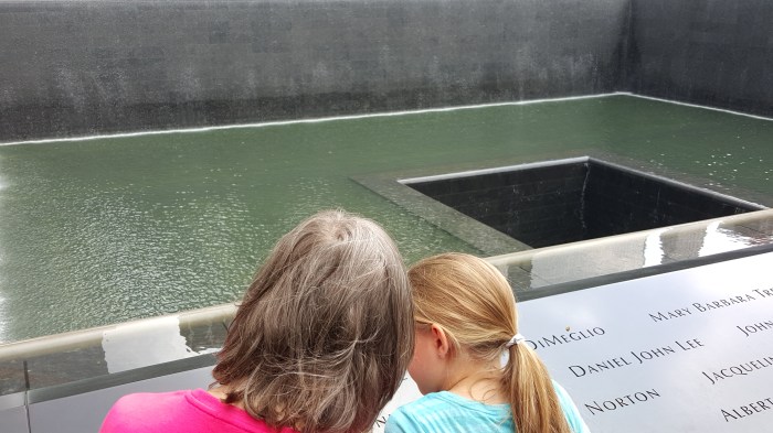 With granddaughter at WTC memorial reflection pond